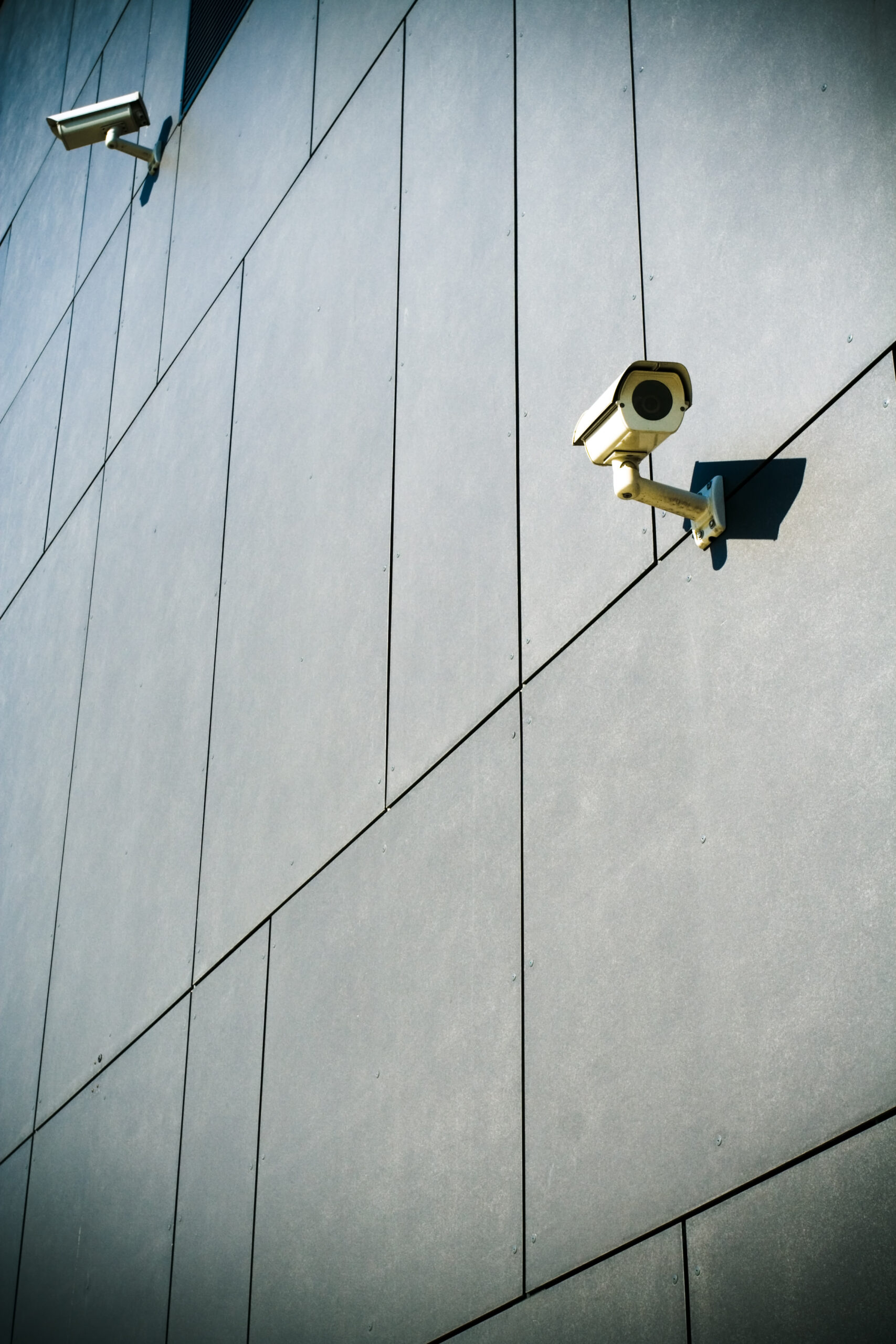 Dark building with security cameras looking around